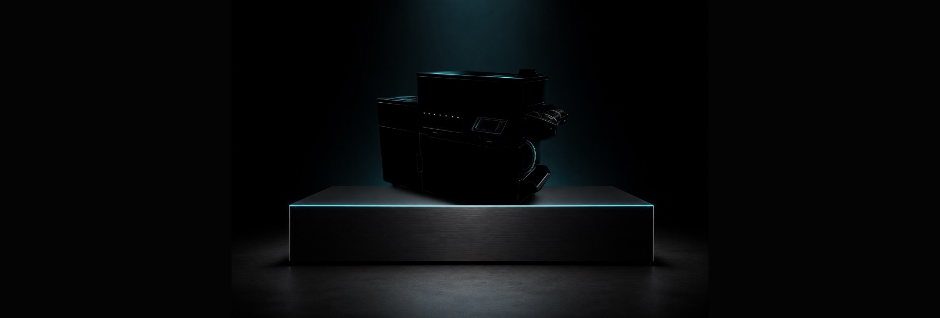 A new DTF production system, lit on a plinth in a darkened hall