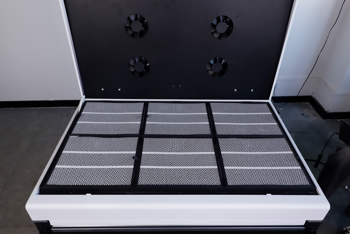 The open purifier cabinet of the Miro 36 with its filter panels and fans