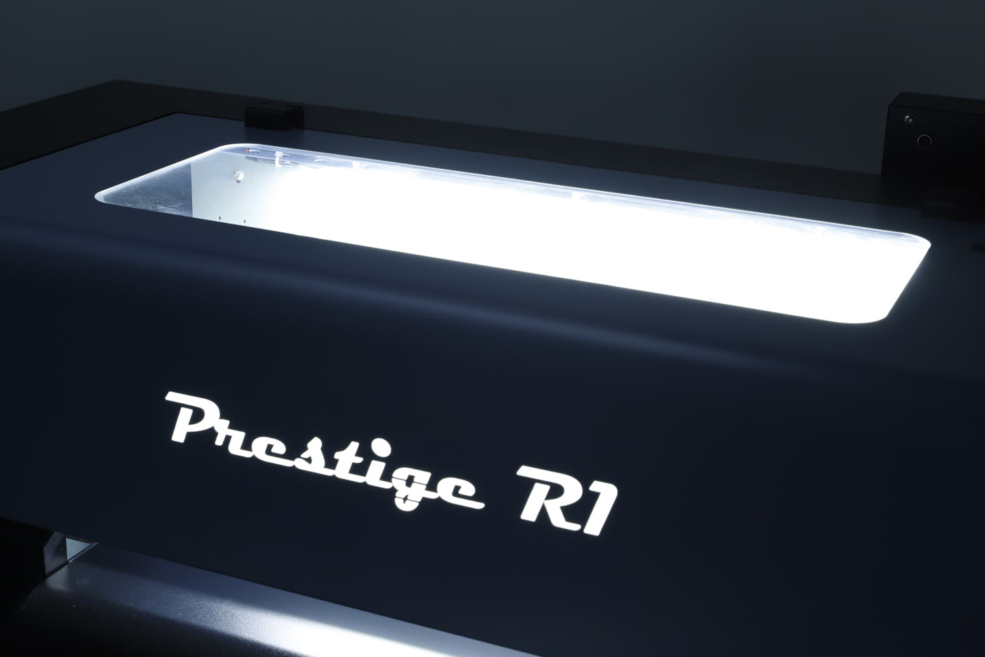 The lit Prestige R1 nameplate