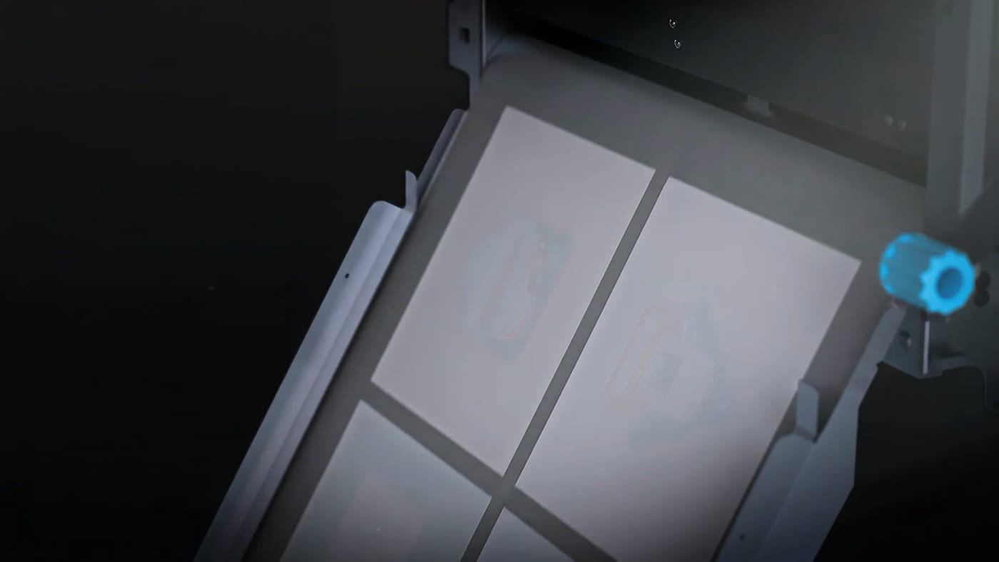 Powder being metered onto a printed sheet inside the Vega S17