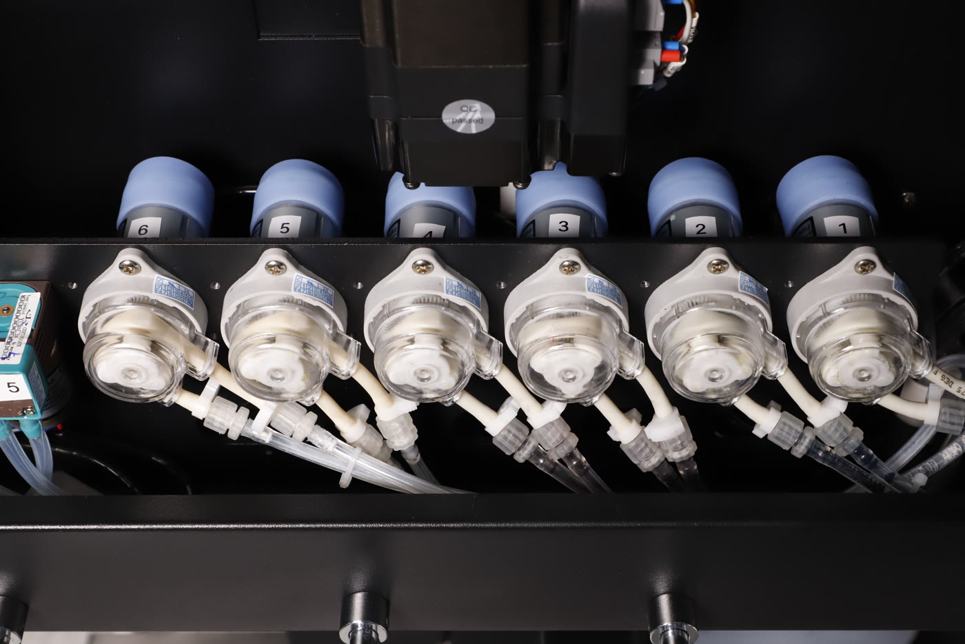 The row of six ink pumps inside the Prestige X6